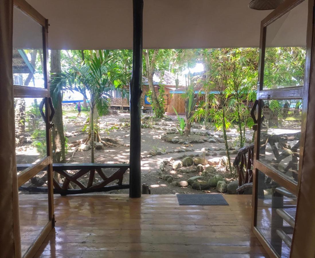 Beach House Resort And Dive Center Мамбахао Экстерьер фото